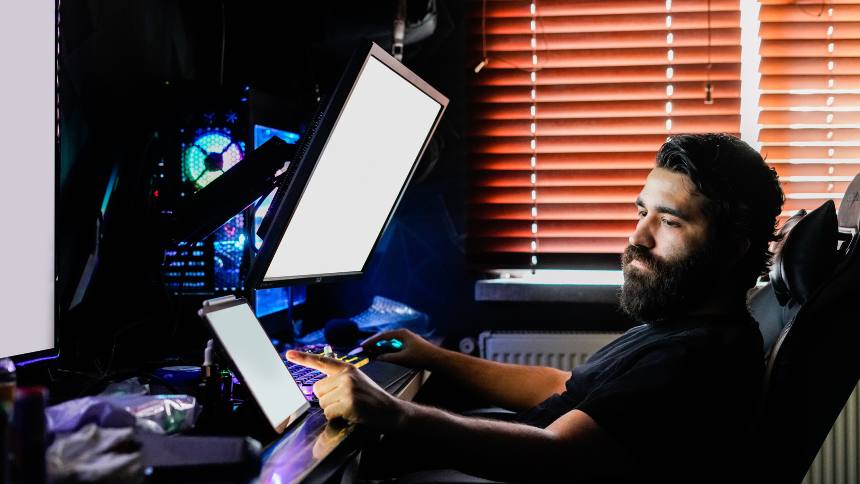 bearded man gamer on multiple monitors design render working on high end computer